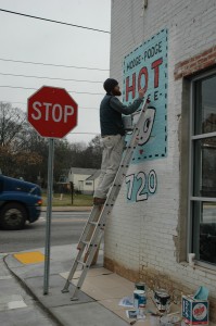 kyle painting on ladder